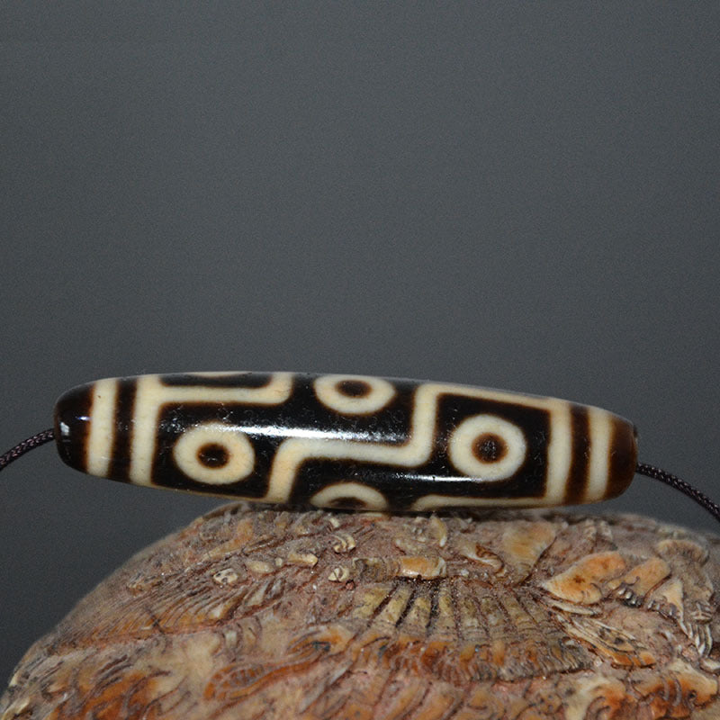 Tibetan Natural Dzi Bead Pendant with Weathered Pattern and High-Gloss Nine-Eyed Design