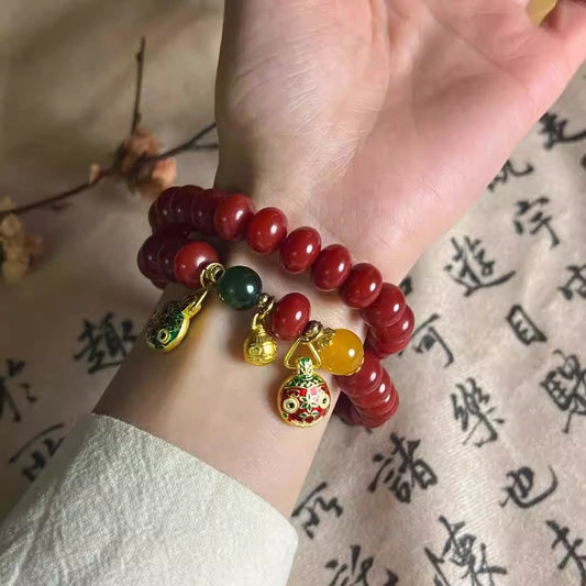 Natural Red Bodhi Root Abacus Bead Bracelet with a Family of Three Golden Pixiu Design, Double-Layer Strand.