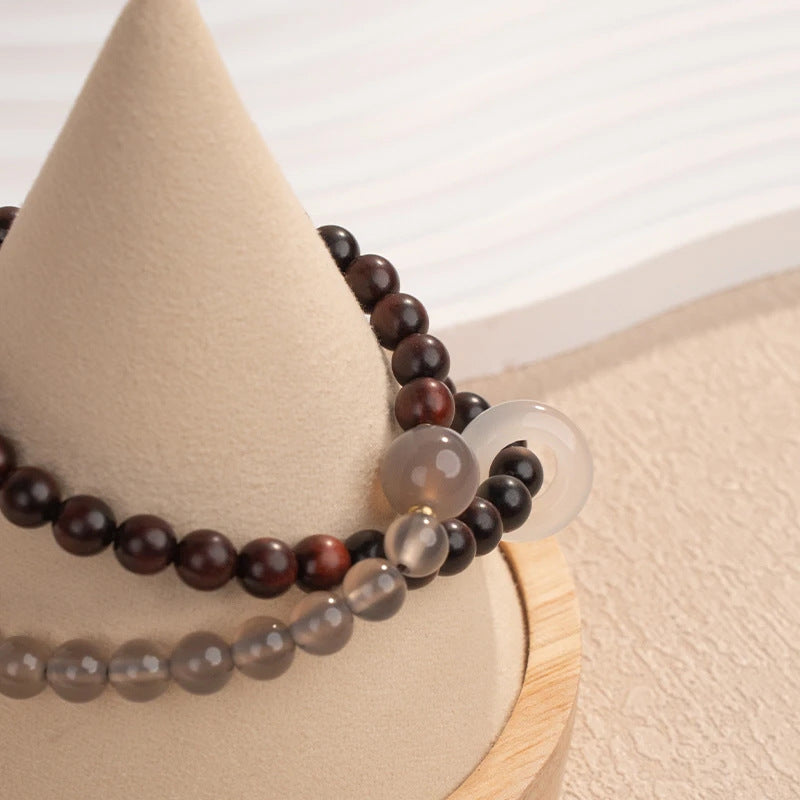 A unique Chinese-style double-wrap bracelet featuring small-leaf rosewood and gray agate round beads, inspired by Fuyao Wutai.