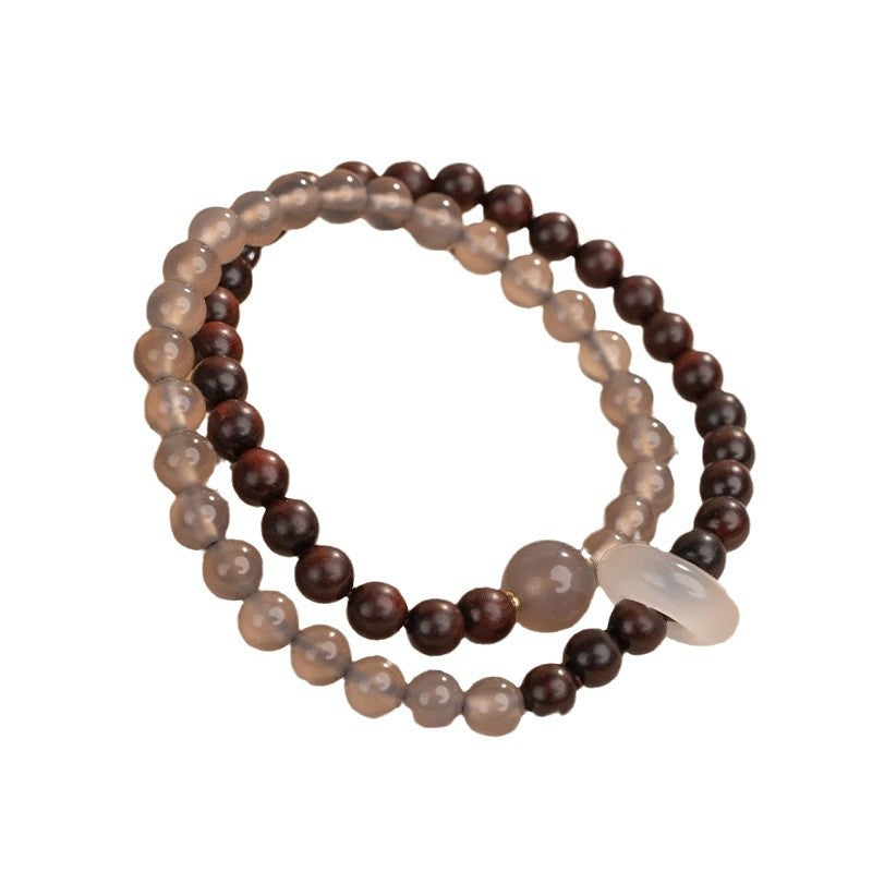 A unique Chinese-style double-wrap bracelet featuring small-leaf rosewood and gray agate round beads, inspired by Fuyao Wutai.