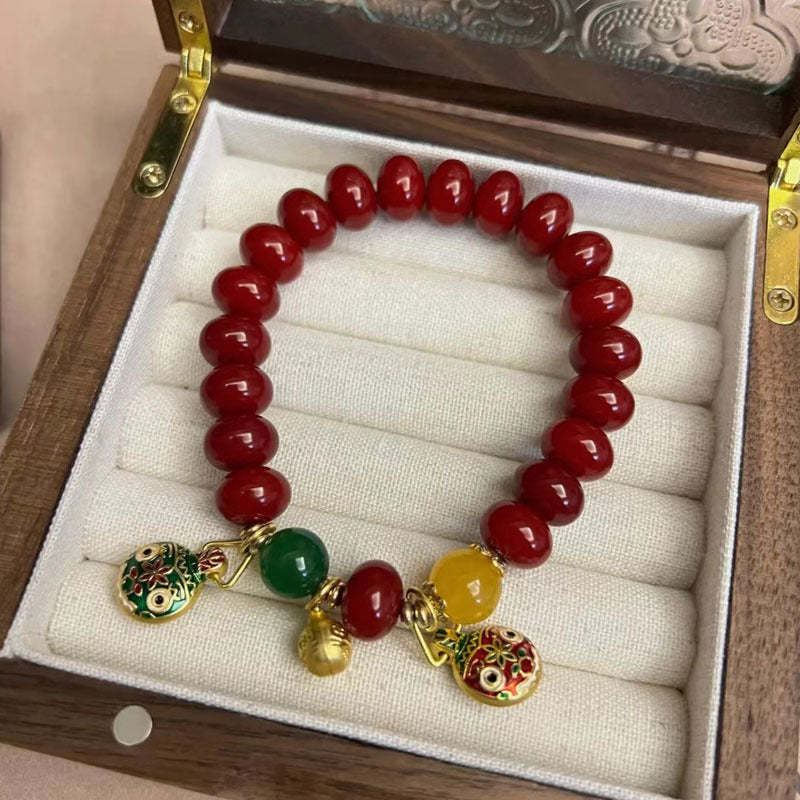 Natural Red Bodhi Root Abacus Bead Bracelet with a Family of Three Golden Pixiu Design, Double-Layer Strand.