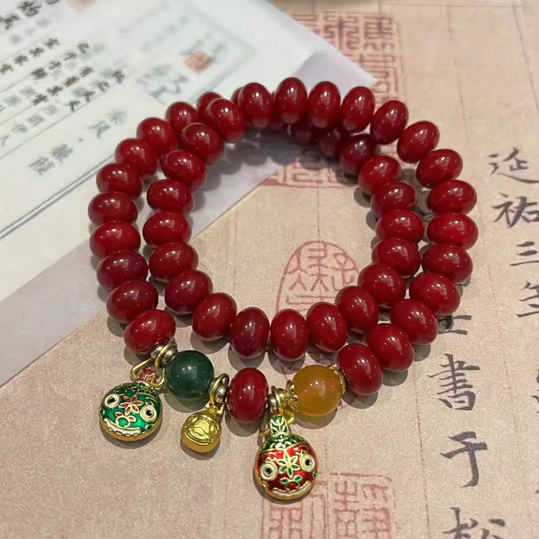 Natural Red Bodhi Root Abacus Bead Bracelet with a Family of Three Golden Pixiu Design, Double-Layer Strand.